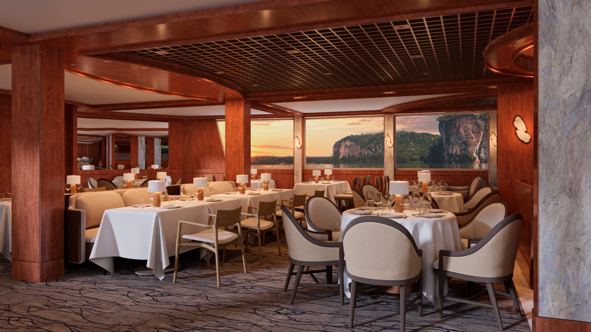 Dining room with dressed tables and river views at sunset